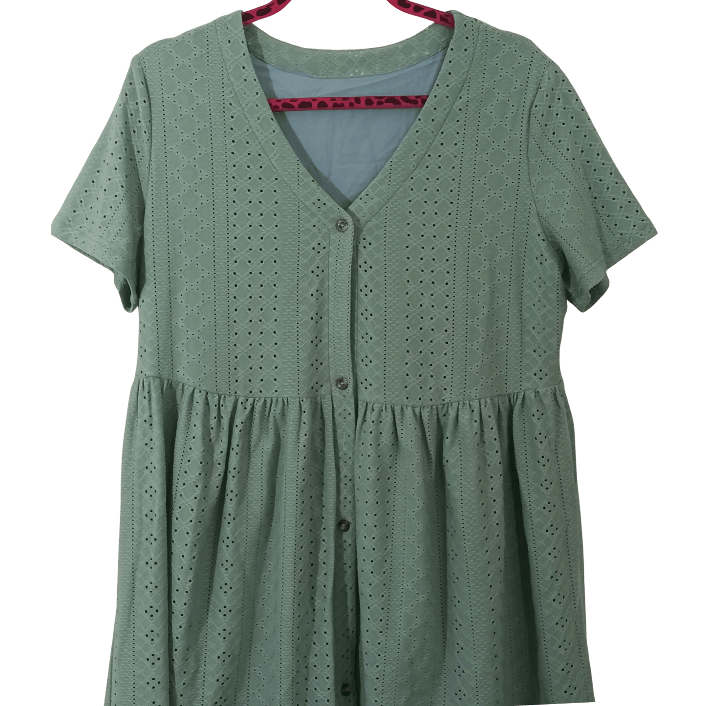 Green dress with button details on a transparent background