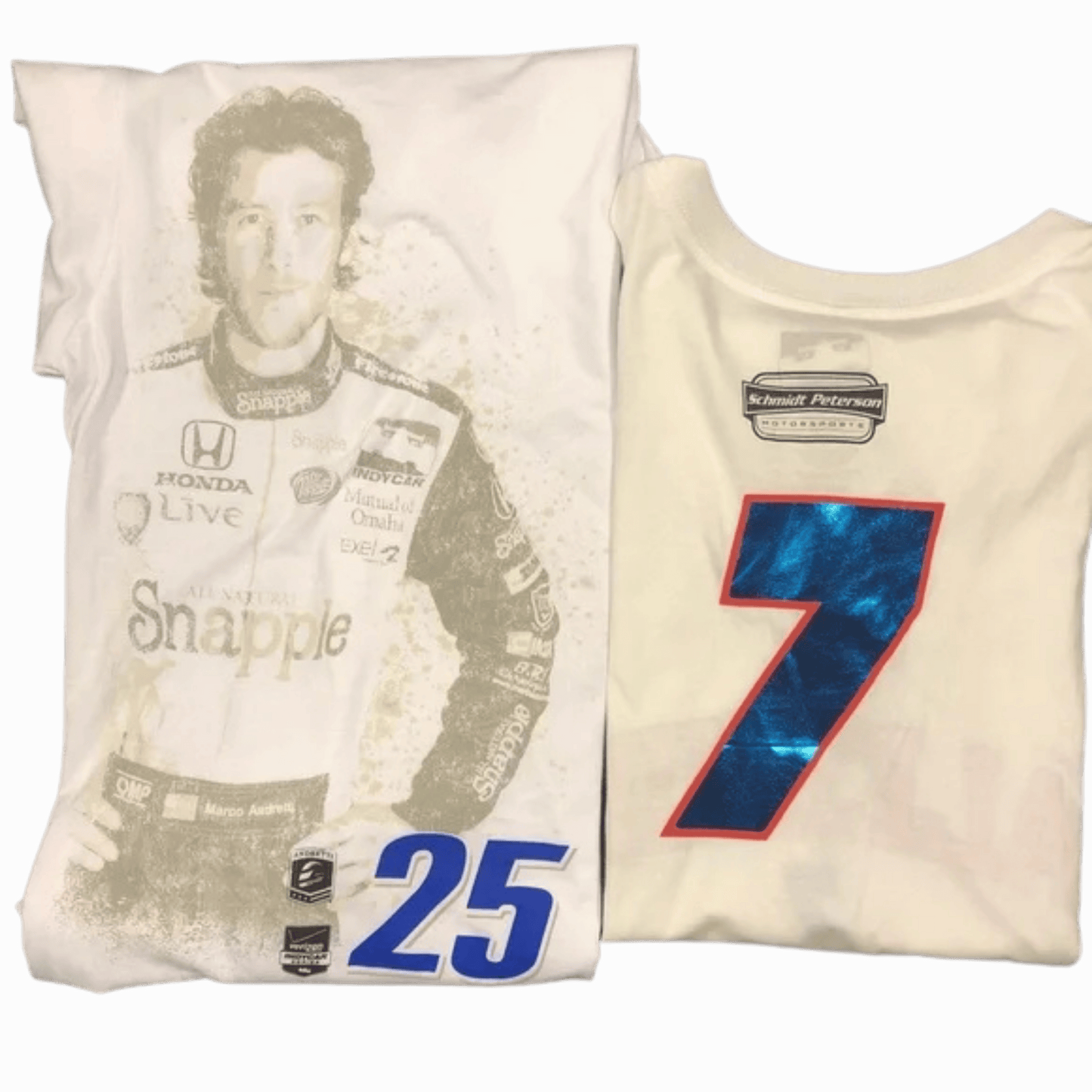 Two folded t-shirts with racing-themed graphics and branding on a dark background