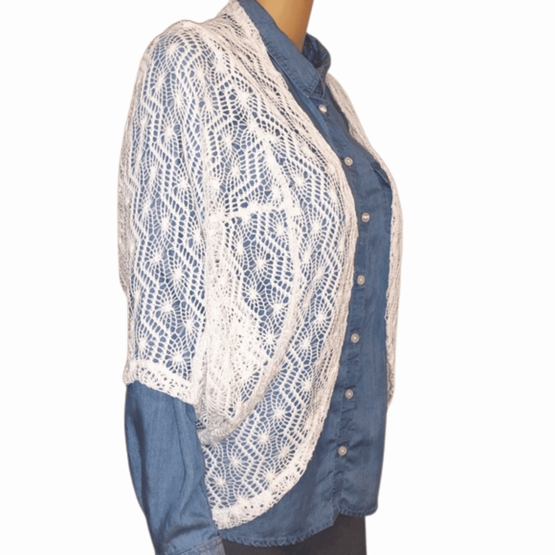 Blue denim shirt with white lace overlay on a plain background
