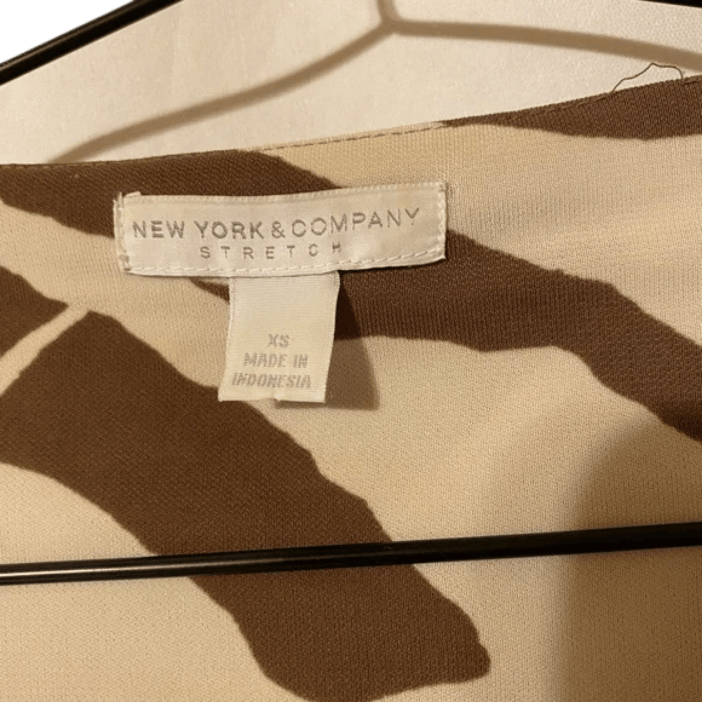 Clothing label on a garment with 'New York & Company' branding