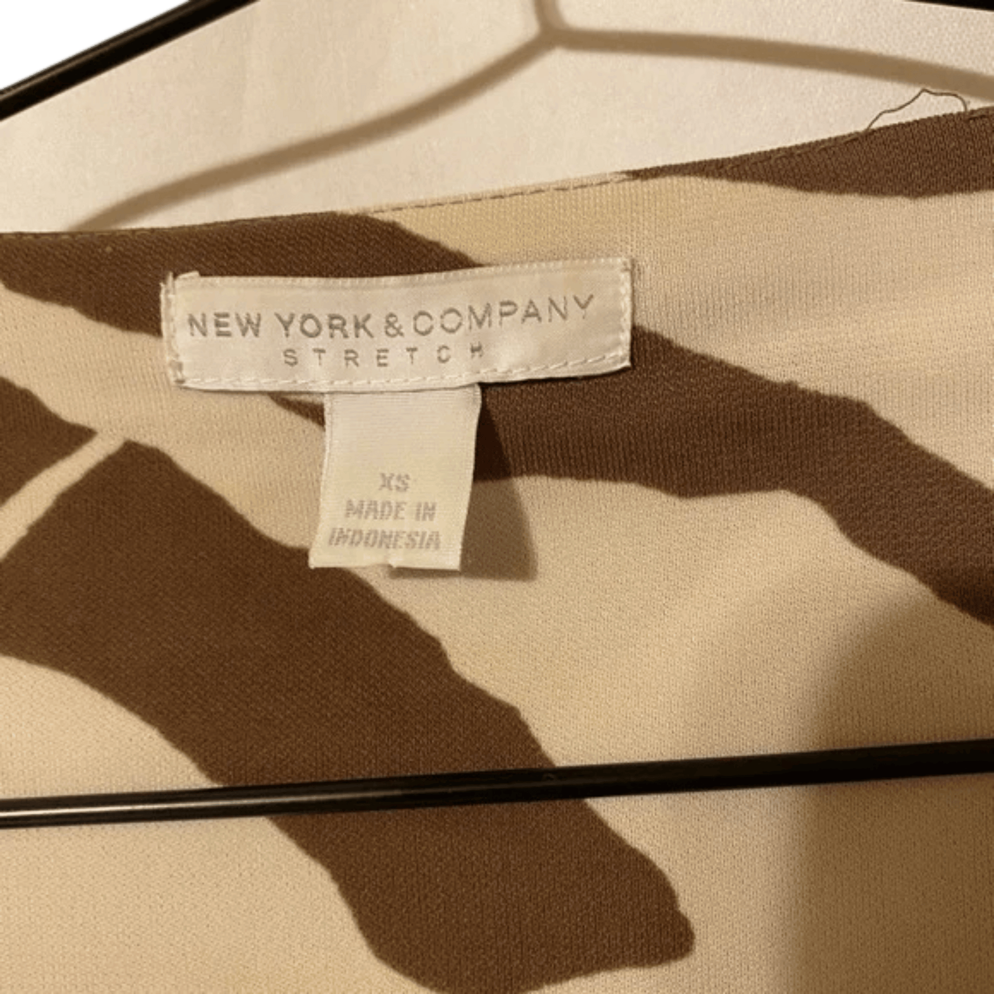Clothing label on a garment with 'New York & Company' branding