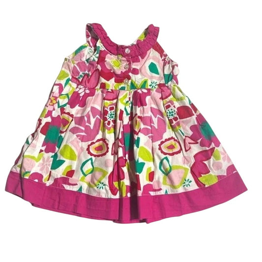 Colorful floral dress with pink trim on a white background