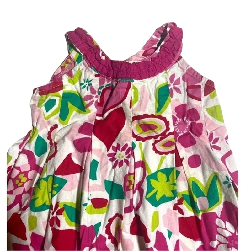 Colorful floral dress with pink straps on a white background