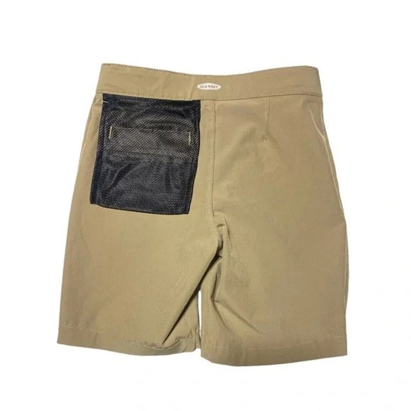 Beige shorts with a black mesh pocket on a white background