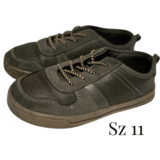 Pair of green shoes with laces on a transparent background