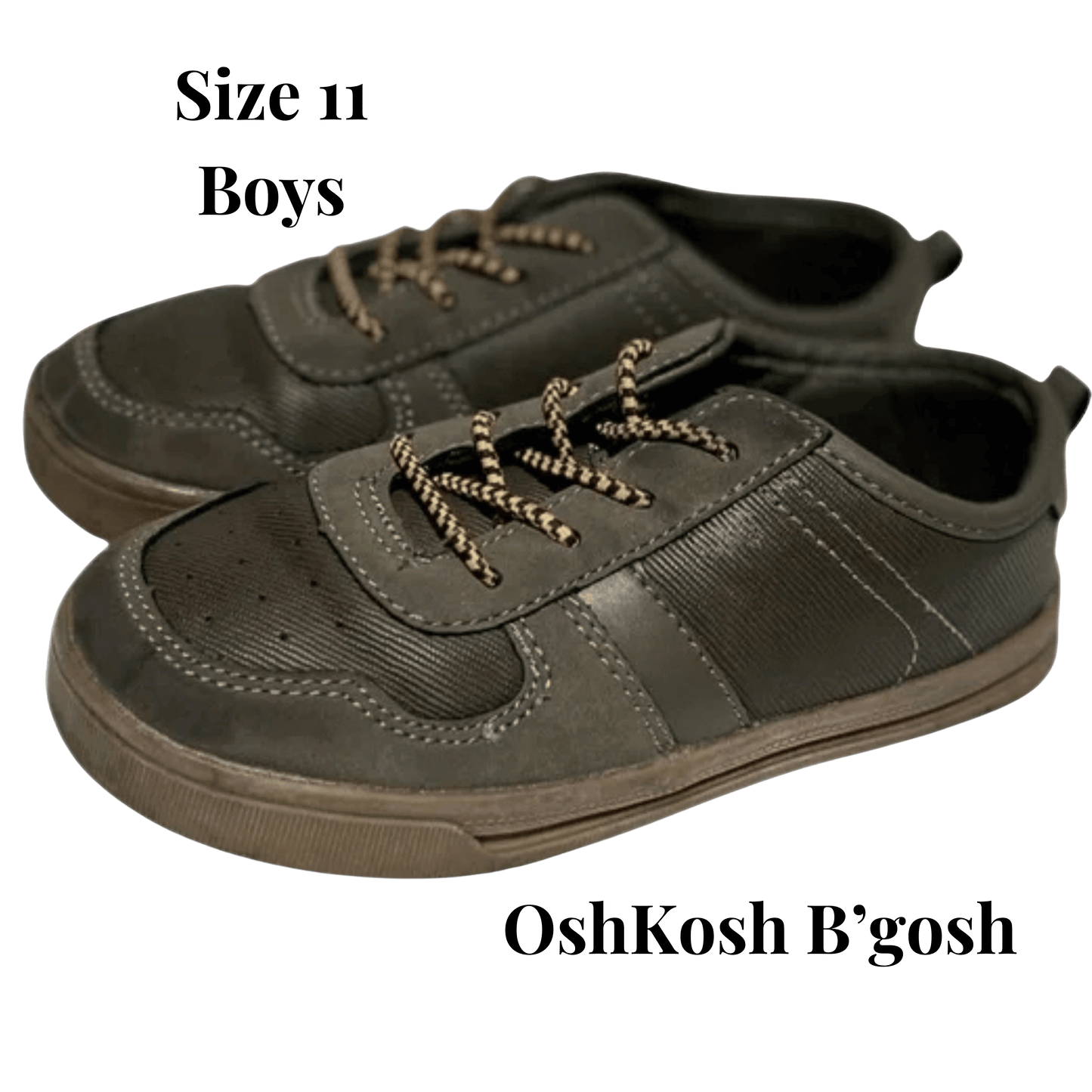 Pair of green boys' shoes with laces on a transparent background, featuring OshKosh B'gosh branding.
