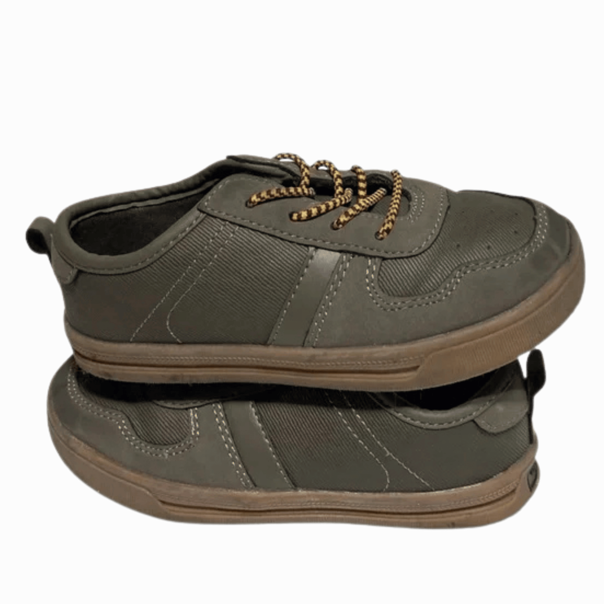 Green sneaker with brown sole on a transparent background