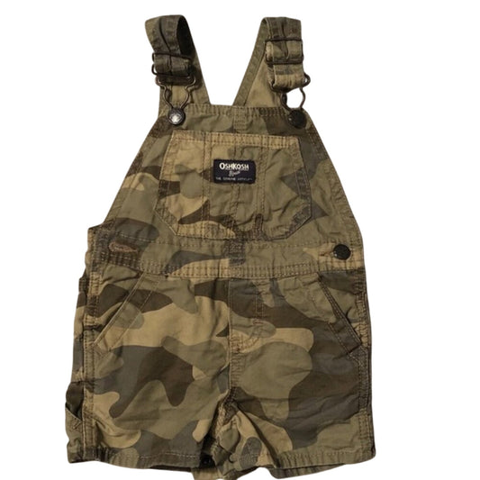 Camouflage overalls with a visible brand label on a white background