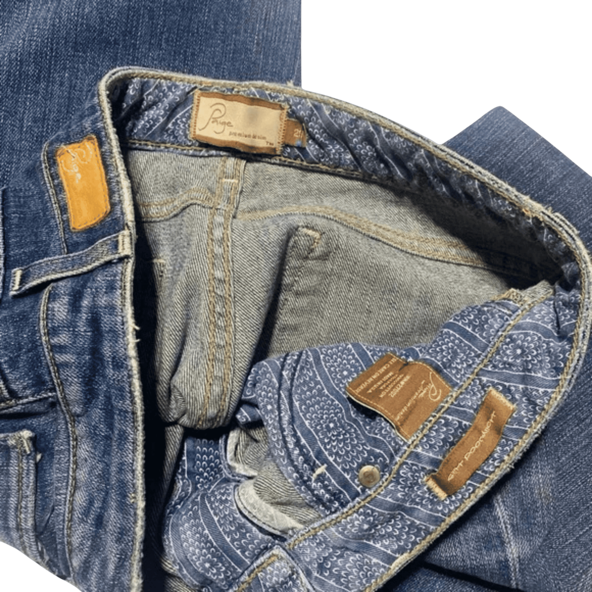 Close-up of blue jeans with brand label on a transparent background