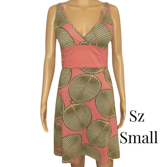 Mannequin wearing a pink and gold patterned dress with 'Sz Small' text.