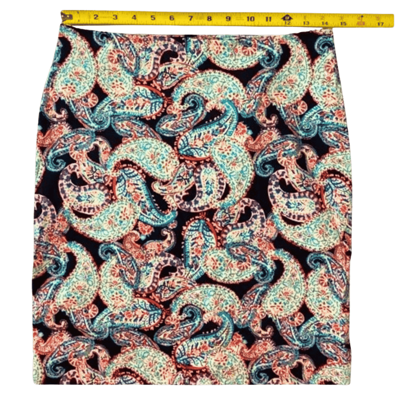 Paisley patterned fabric with a measuring tape at the top