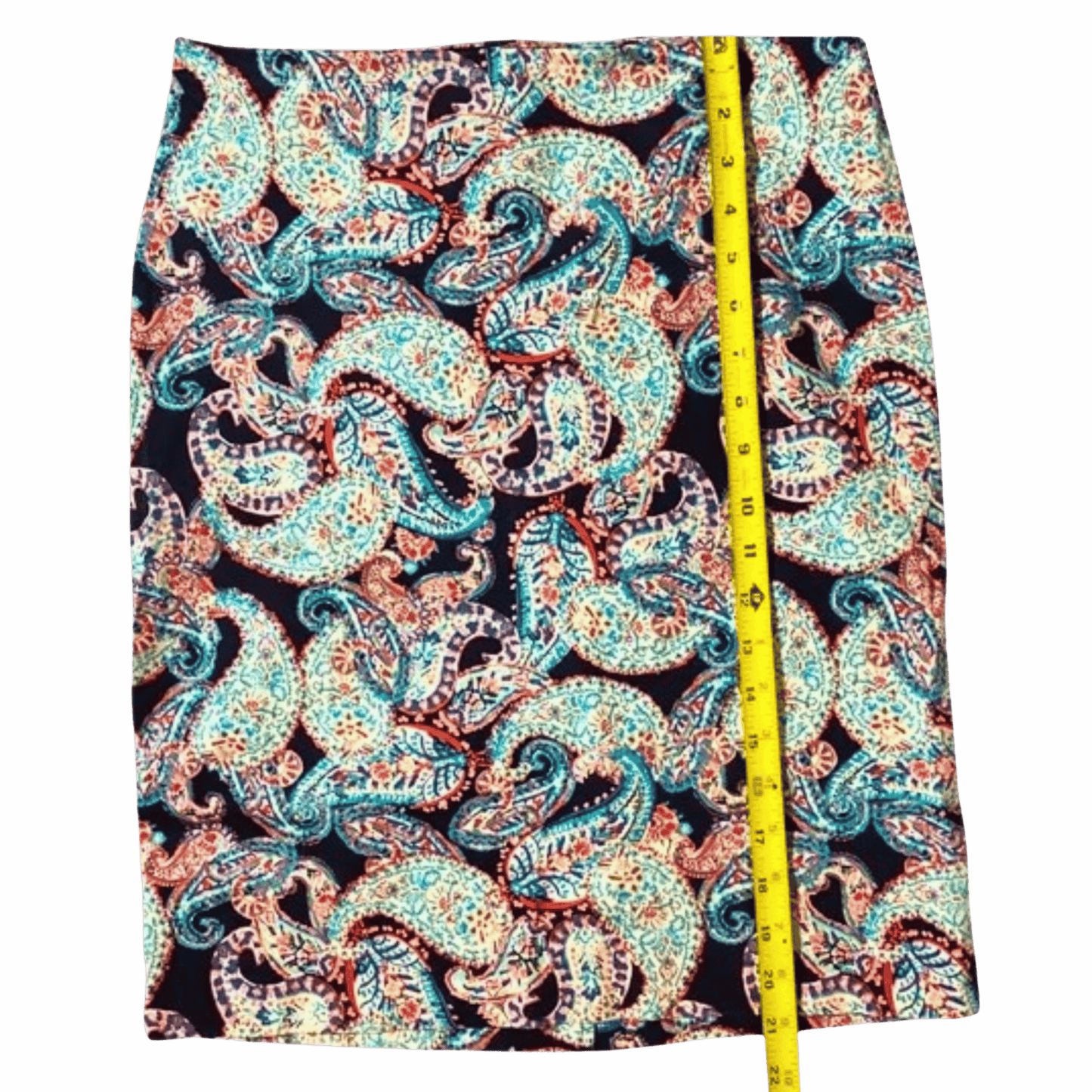 Patterned fabric with a measuring tape on a gray background