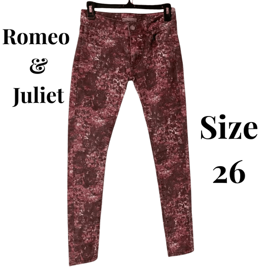 Maroon distressed jeans on a hanger with 'Romeo & Juliet' branding and size '26' text.