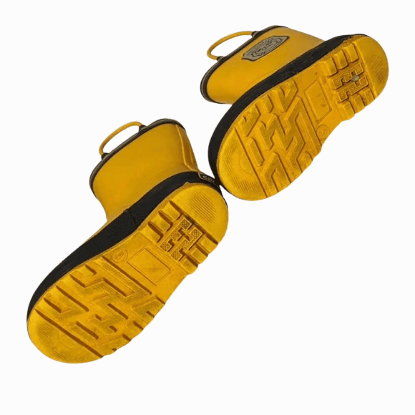Yellow sandals with black soles on a brown background