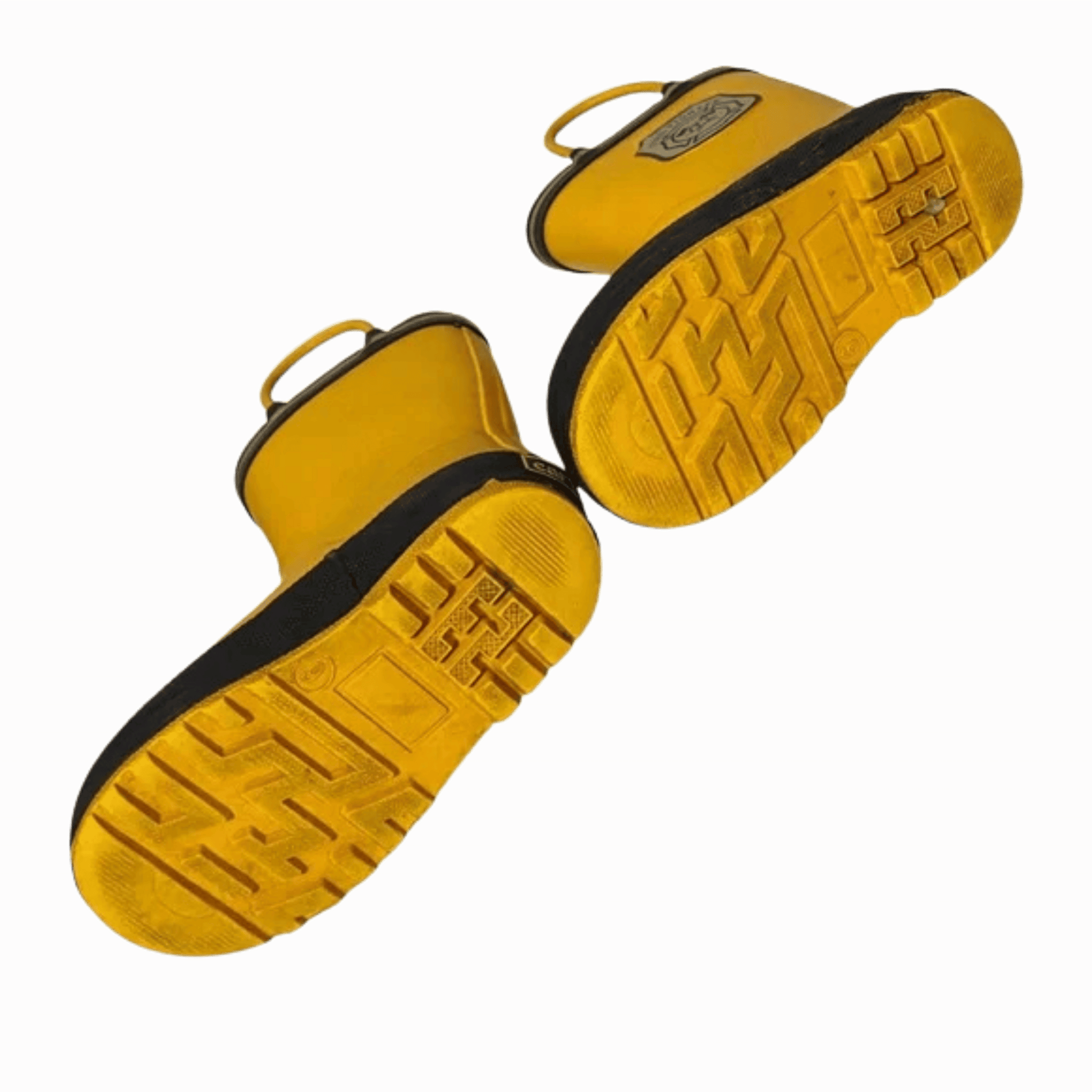 Yellow sandals with black soles on a brown background