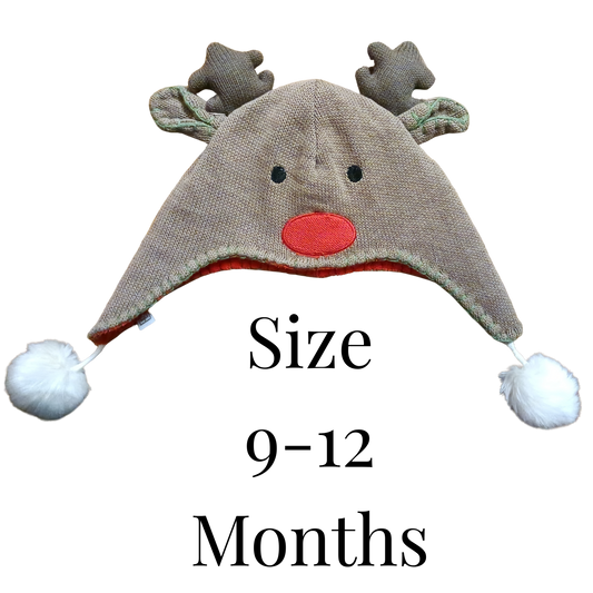 Children's reindeer hat with antlers and pom-poms on a white background, size 9-12 months.