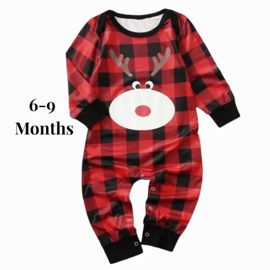 Red and black checkered baby romper with reindeer face design on a gray background