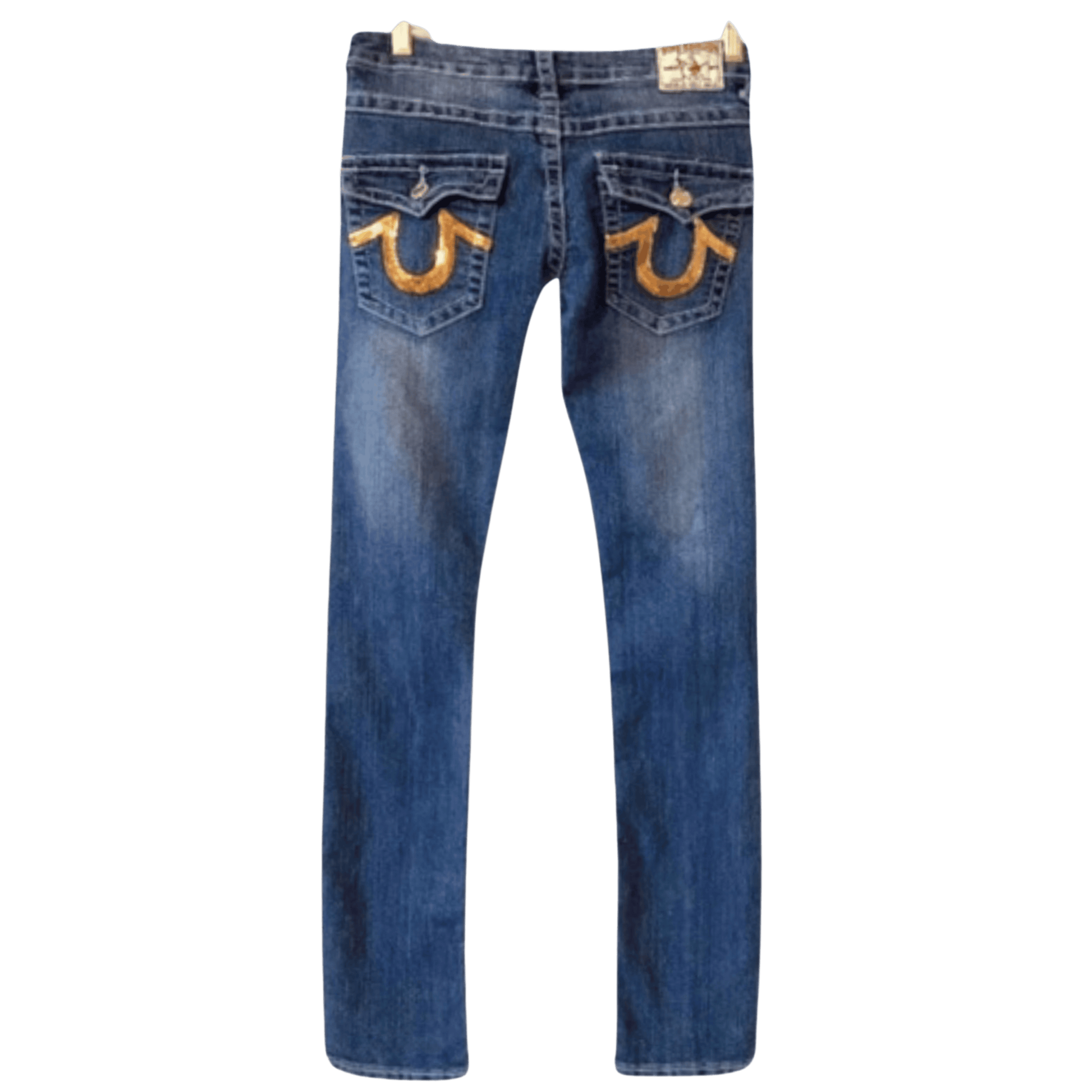 Blue jeans with gold horse shoe designs on the pockets against a transparent background