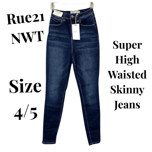 Super high waisted skinny jeans with a tag on a green background, labeled 'Rue21 NWT Size 4/5'.