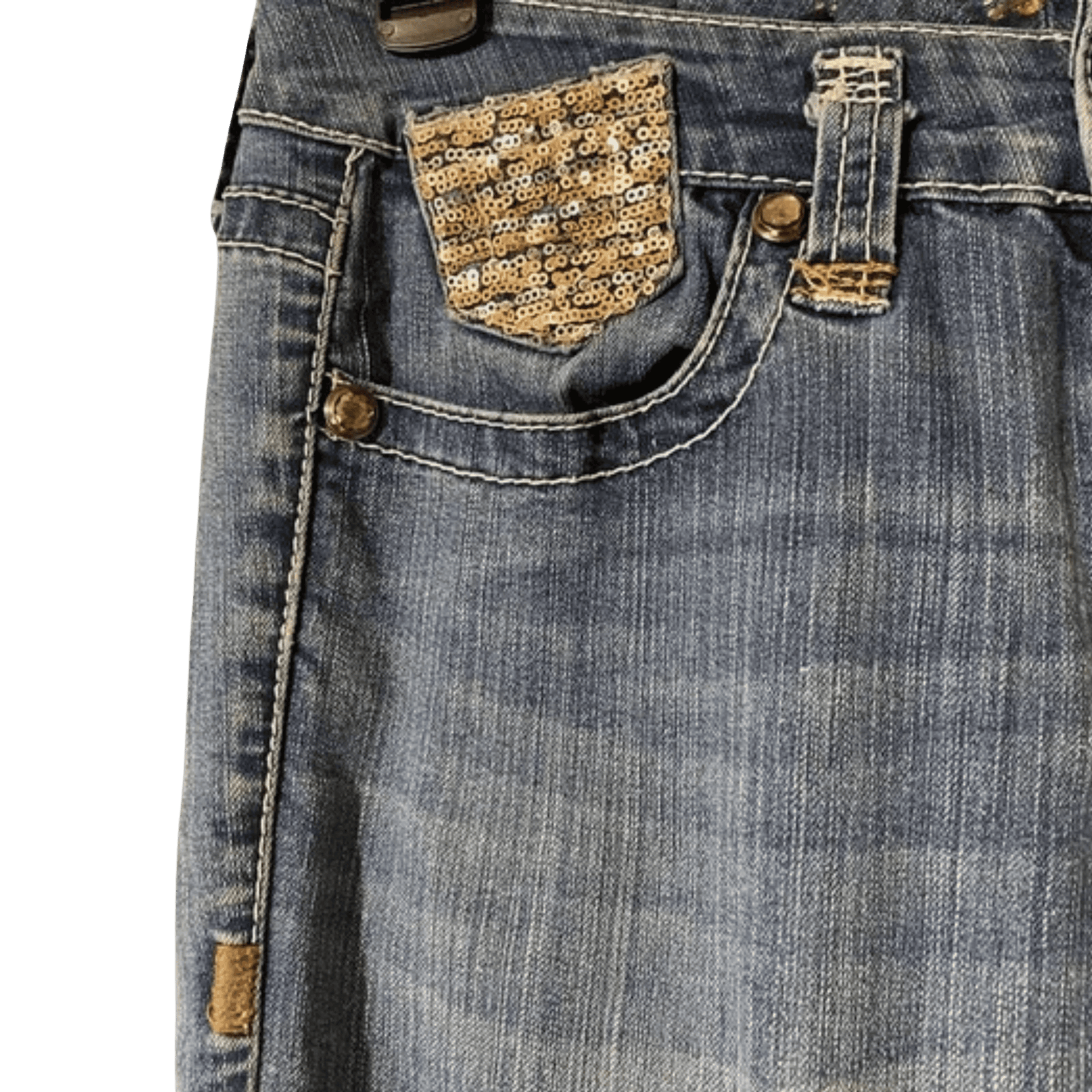 Close-up of blue jeans with decorative pocket and stitching details on a green background