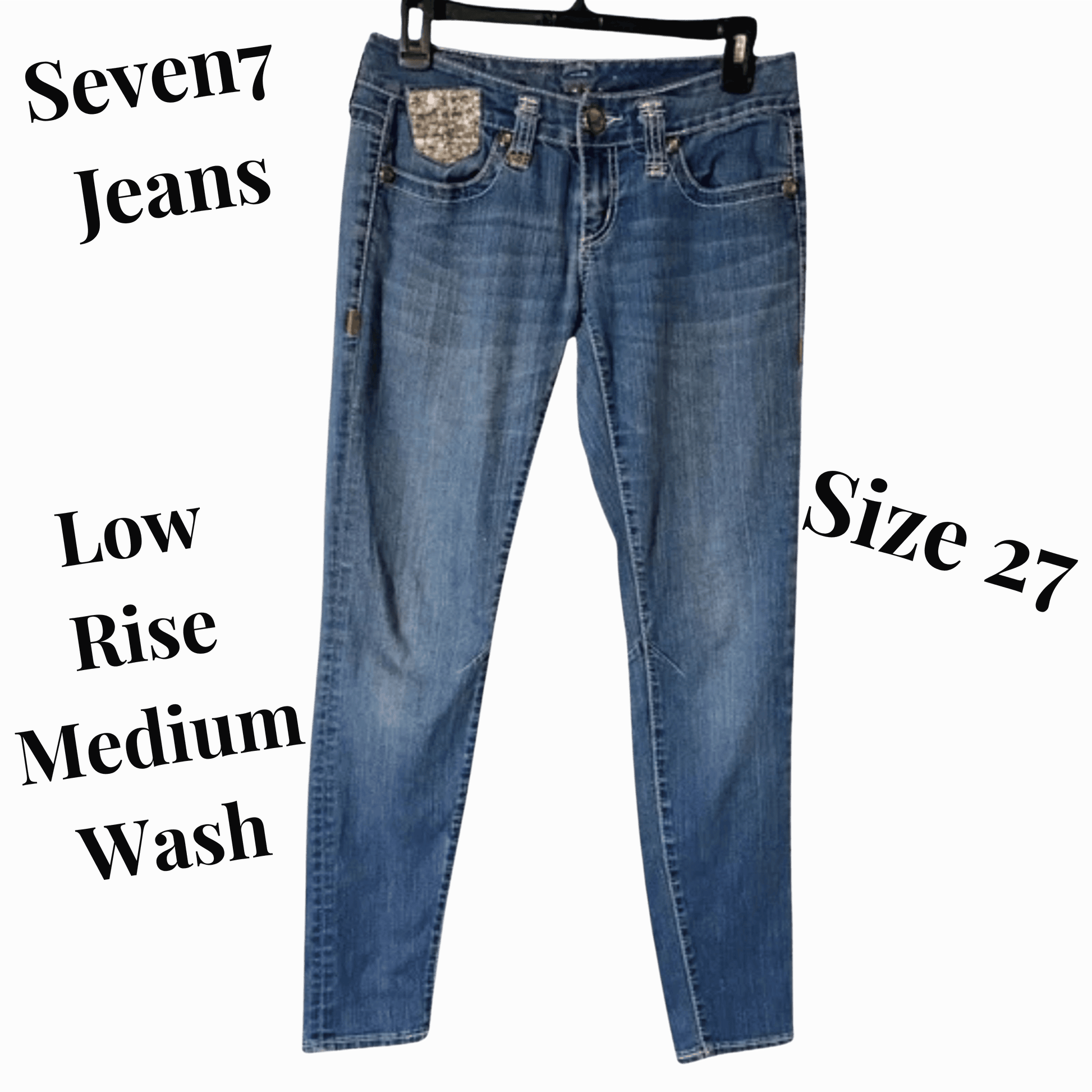 Blue jeans with 'Seven7 Jeans' branding on a gray background