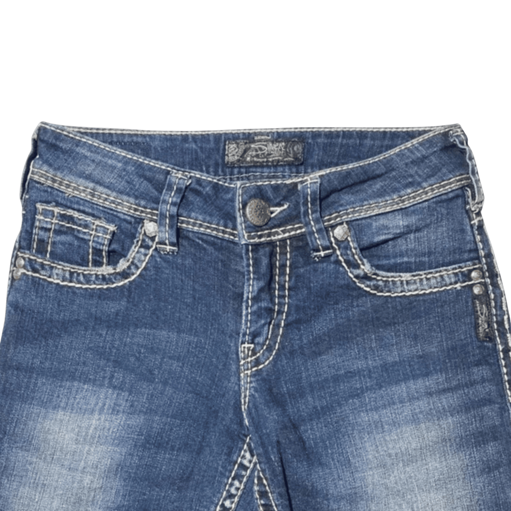 Close-up of blue jeans with a brand label on a white background
