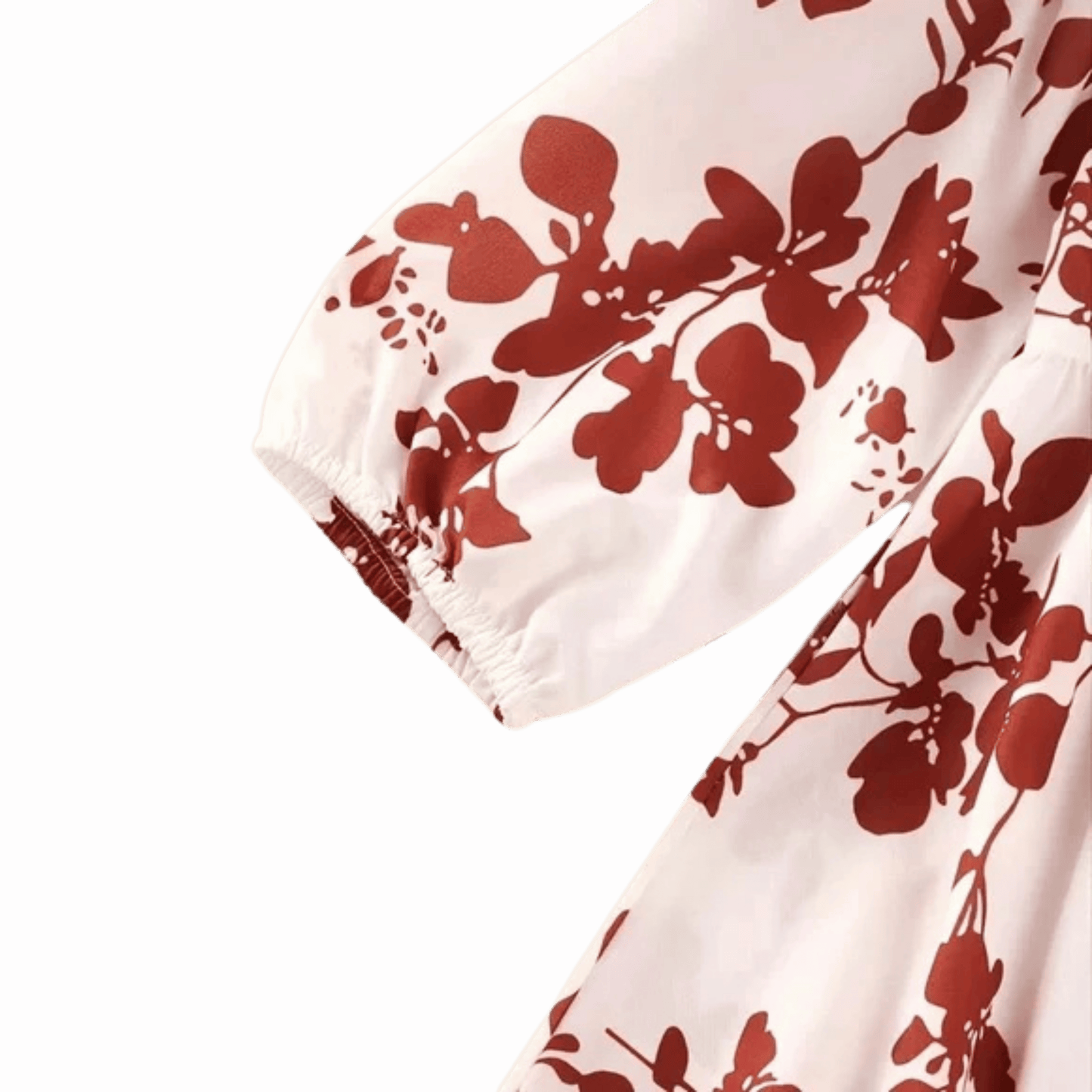 White fabric with red floral pattern on a pink background