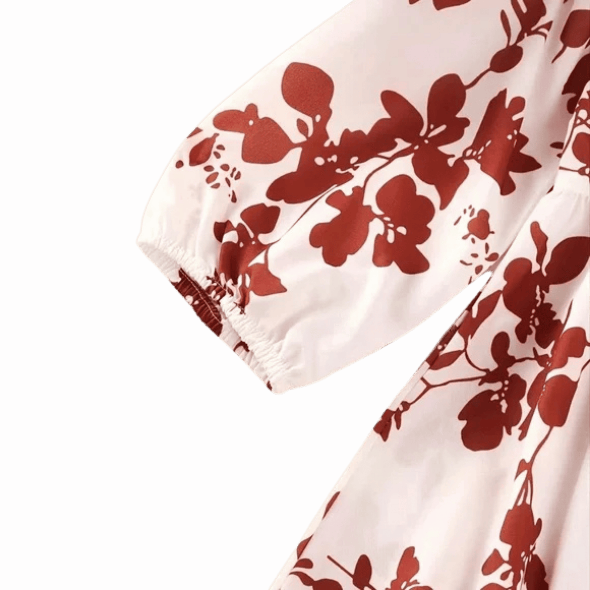 White fabric with red floral pattern on a pink background