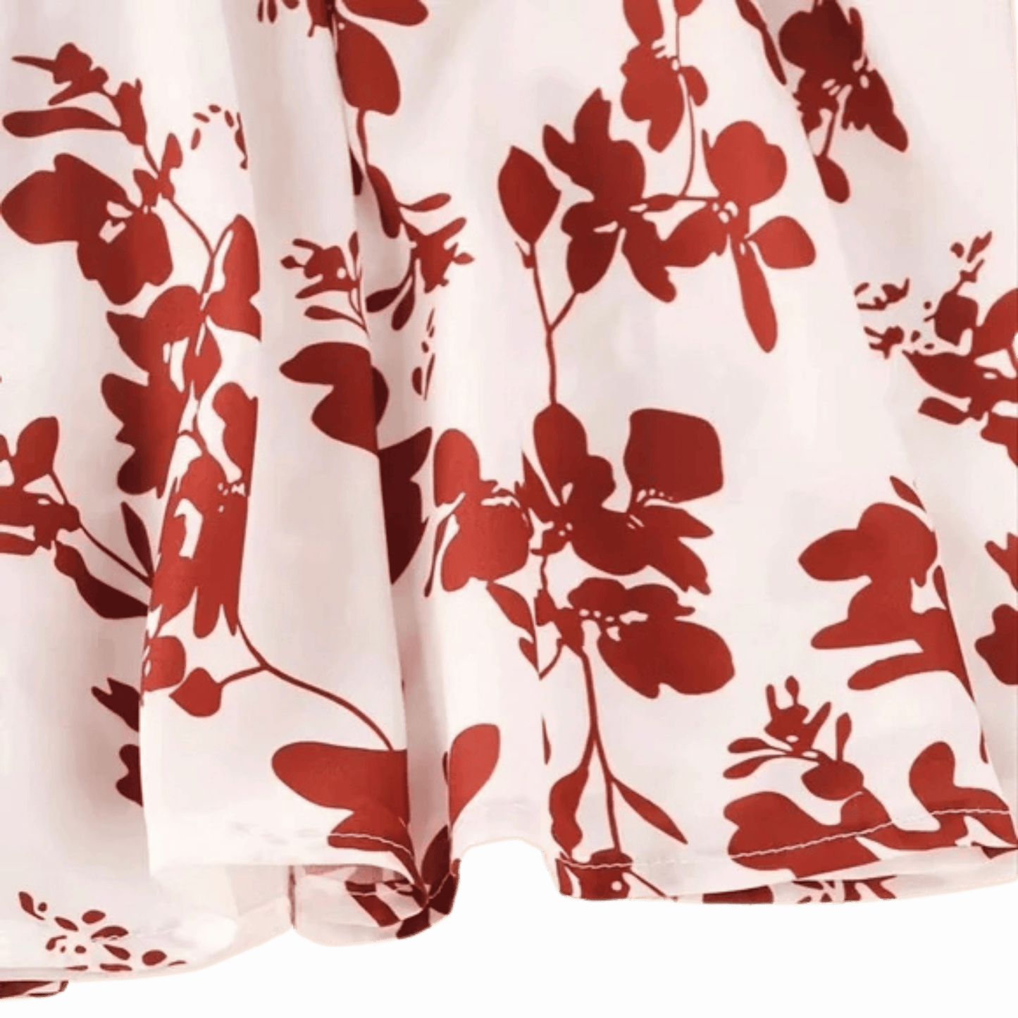 Red floral pattern on white fabric