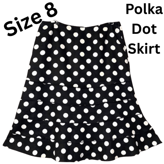 Black polka dot skirt with text indicating size 8 and type on a transparent background