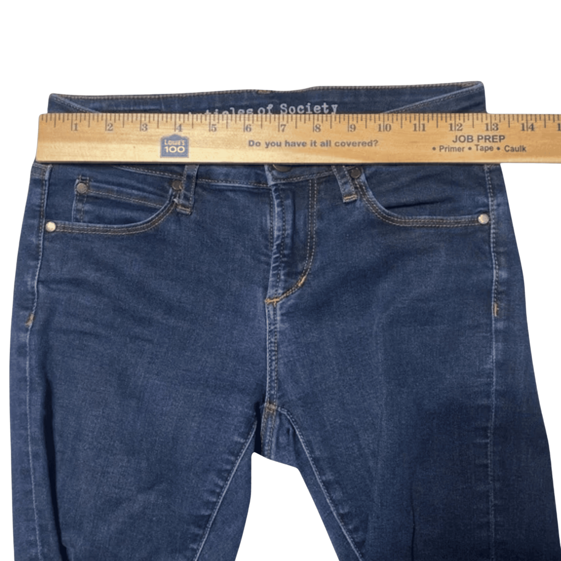 Blue jeans with a ruler on top against a transparent background