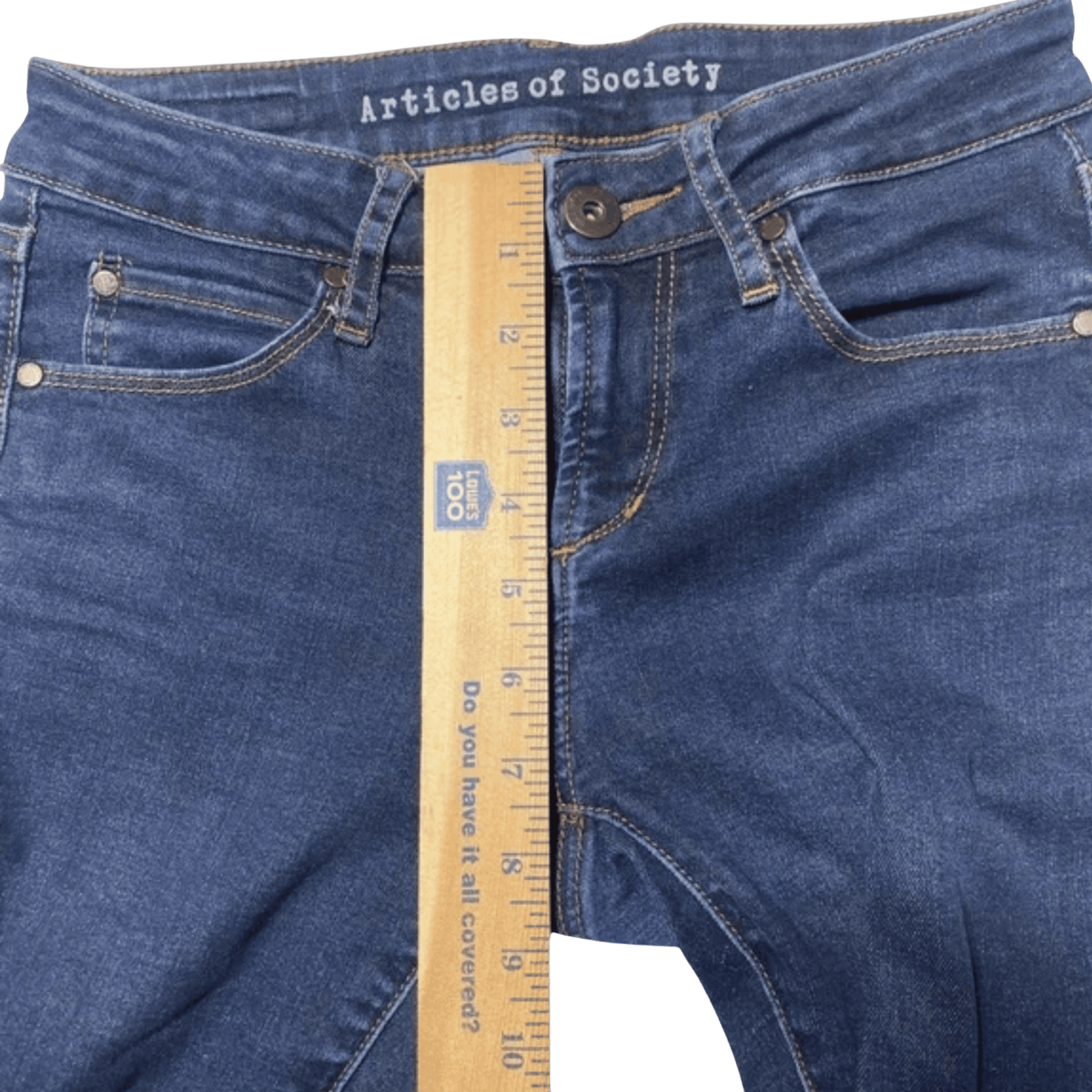 Blue jeans with a ruler for size reference on a transparent background