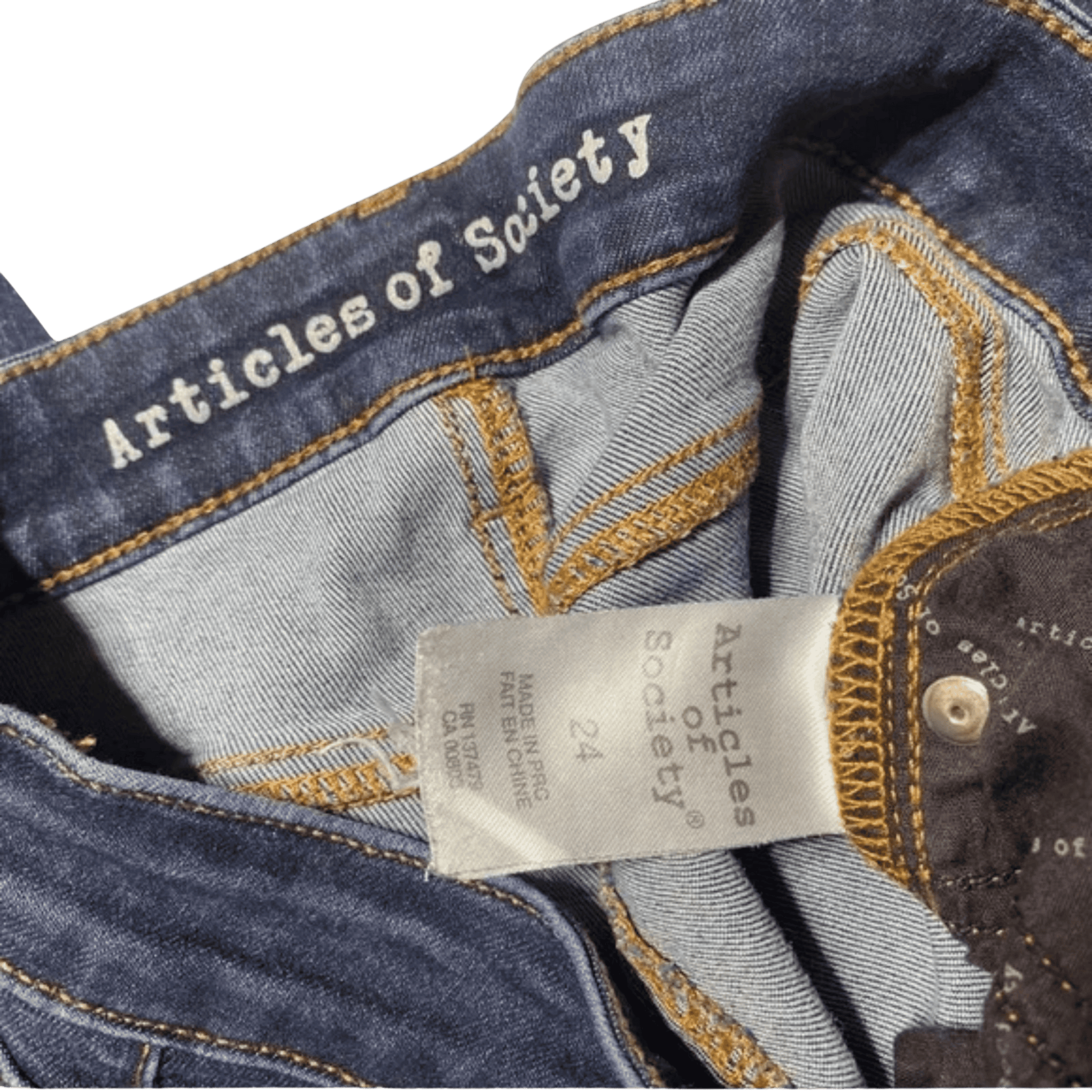 Close-up of denim fabric with 'Articles of Safety' branding and a label.