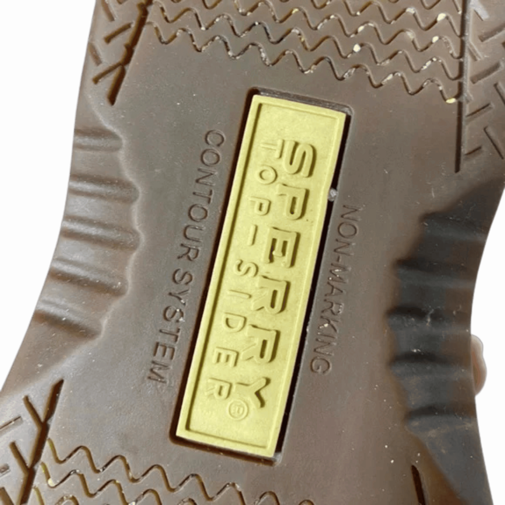 Close-up of a Sperry logo on the sole of a shoe with a gray background