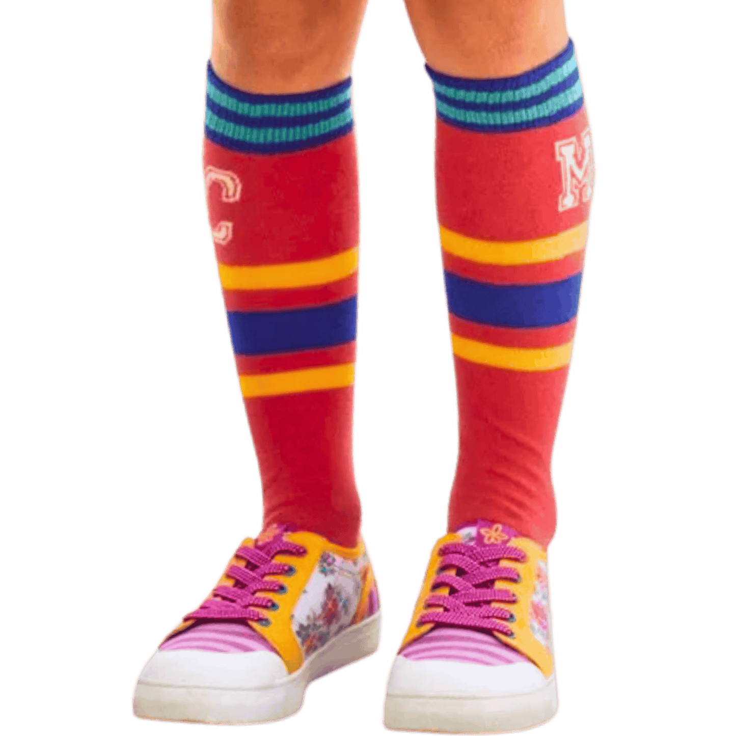 Colorful knee-high socks with stripes and sneakers on a green background
