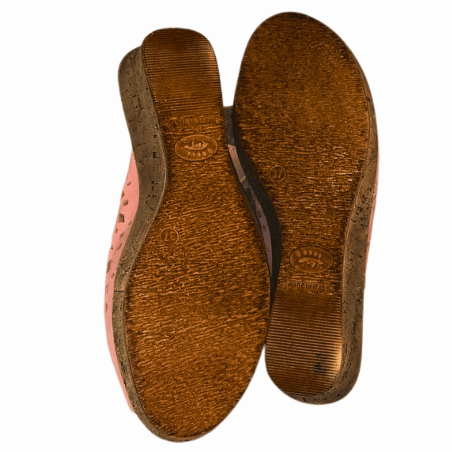 Brown shoe sole on a pink background