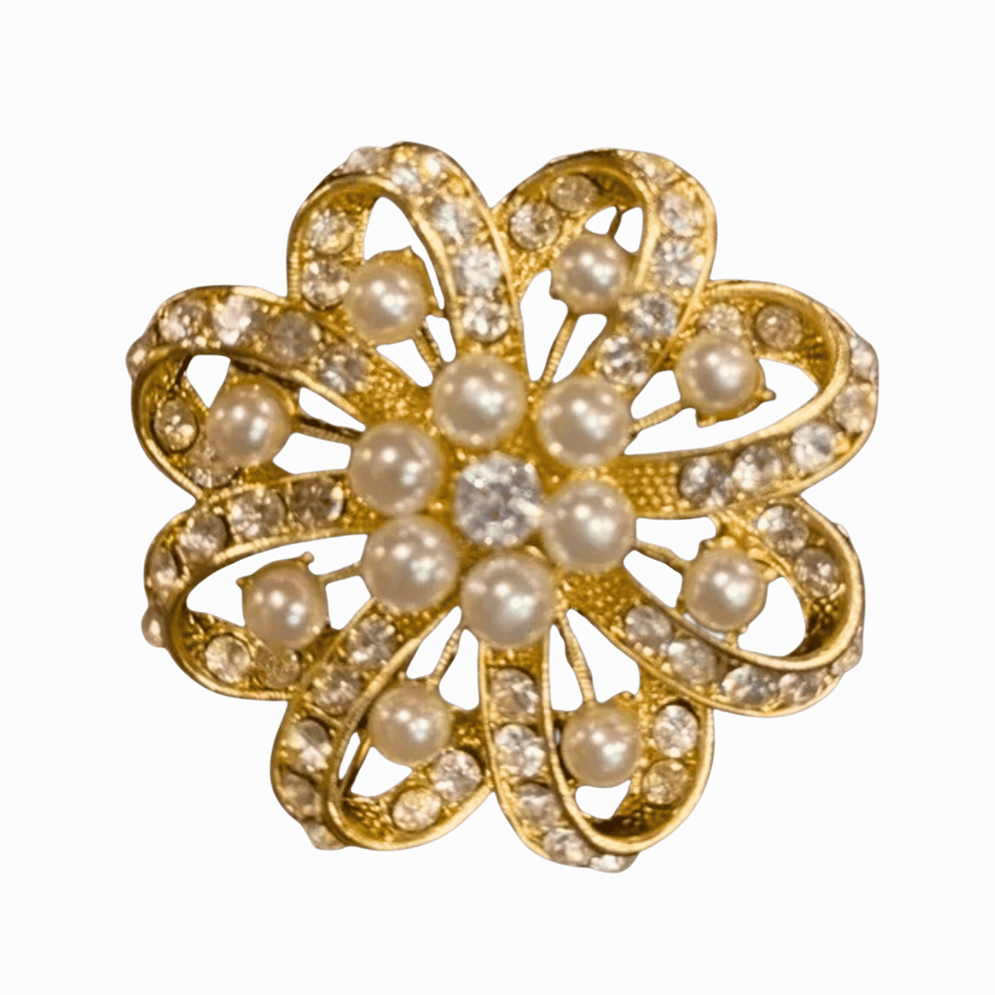 Gold brooch with pearls and crystals on a brown background