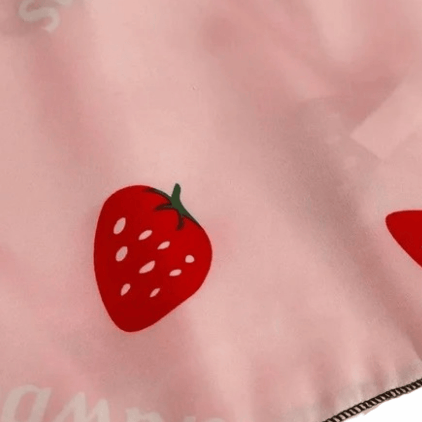 Red strawberry design on a pink background