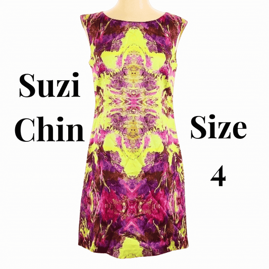 Colorful patterned dress with 'Suzi Chin' and size '4' text on a beige background