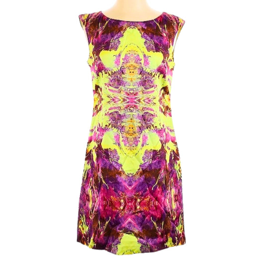Colorful patterned dress on a mannequin against a white background