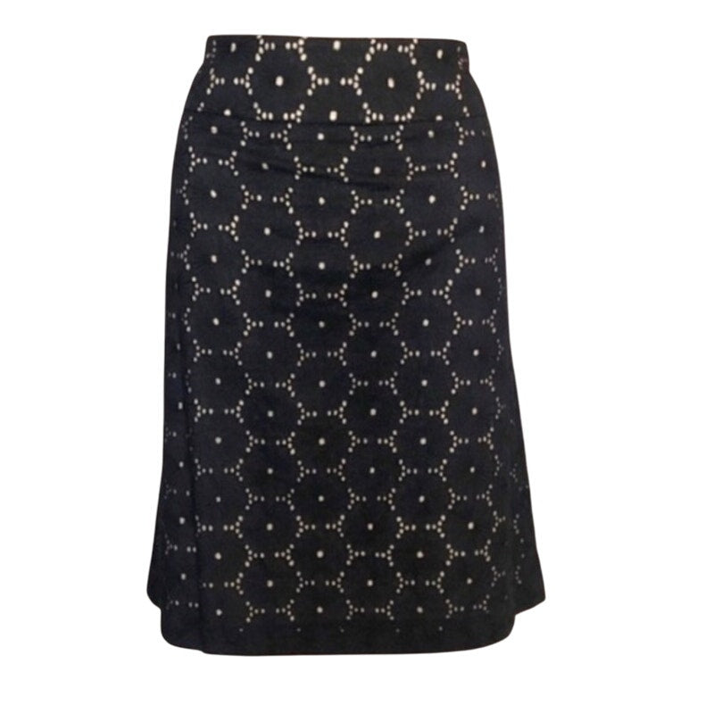 Black skirt with white geometric pattern on a white background