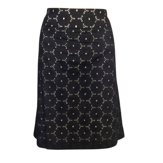 Black skirt with white geometric pattern on a white background
