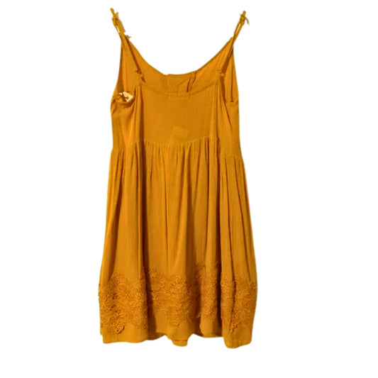 Yellow dress hanging on a white background