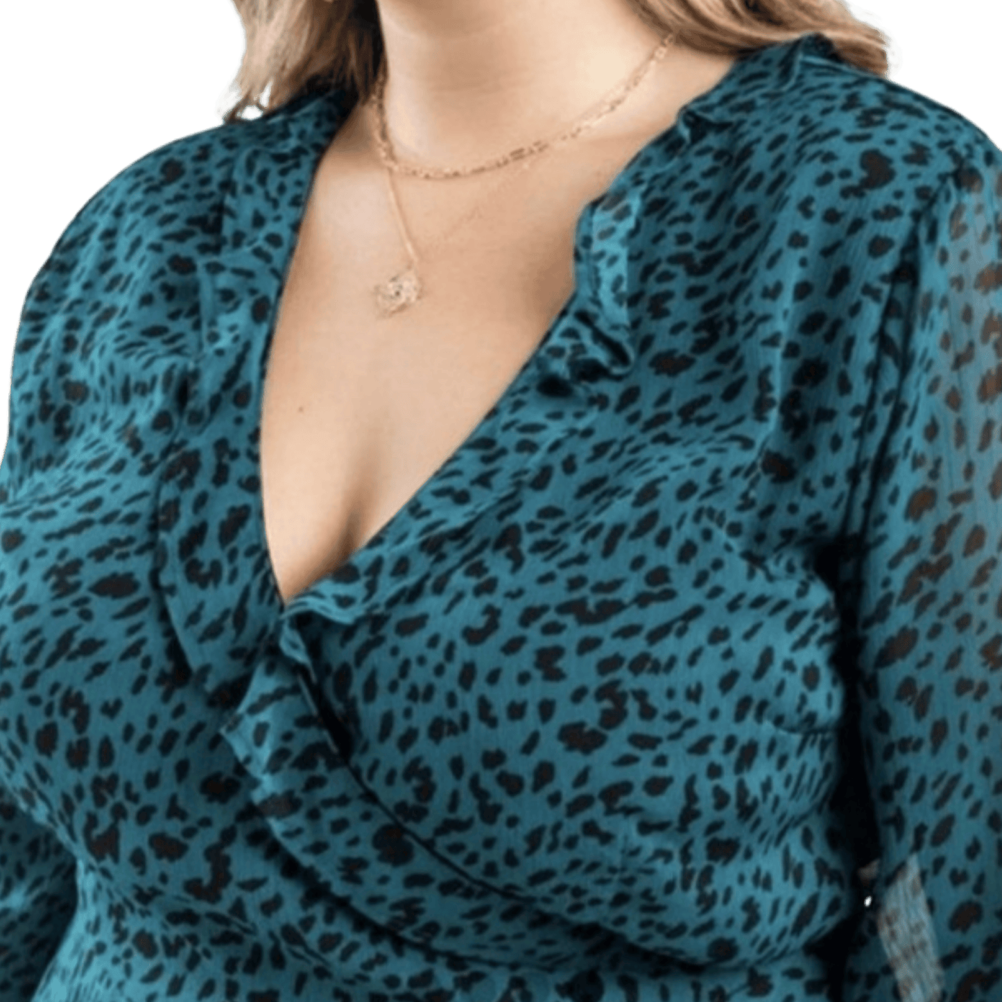 Teal leopard print top worn by a person with a clear background