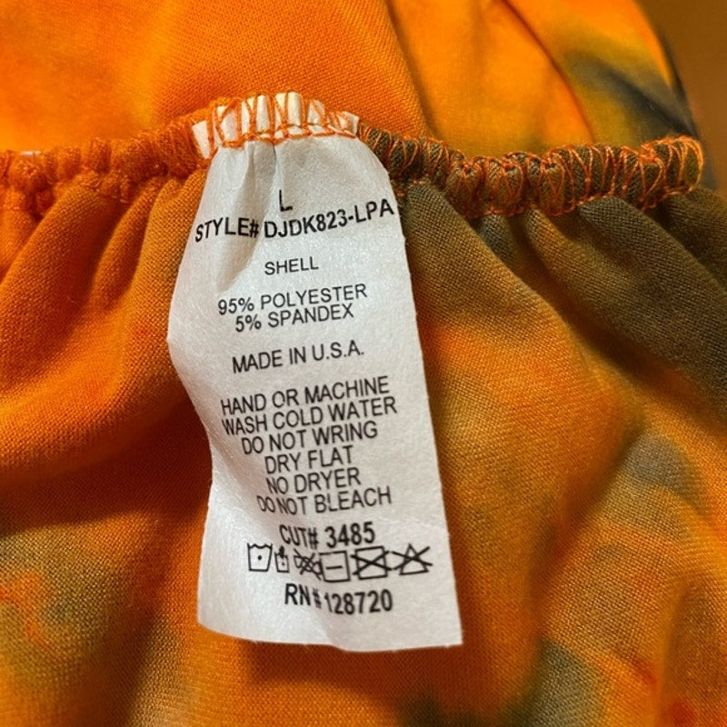 Clothing label on an orange garment with fabric texture