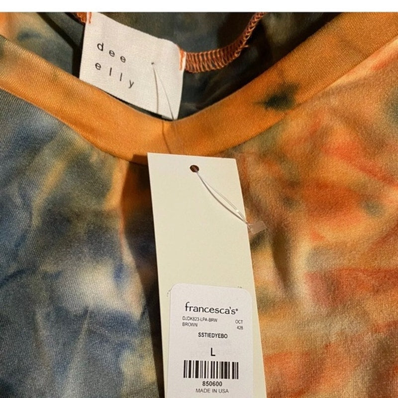 Tie-dye shirt with a Francesca's tag on a blurred background