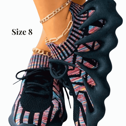 Colorful patterned socks with black shoes on a transparent background