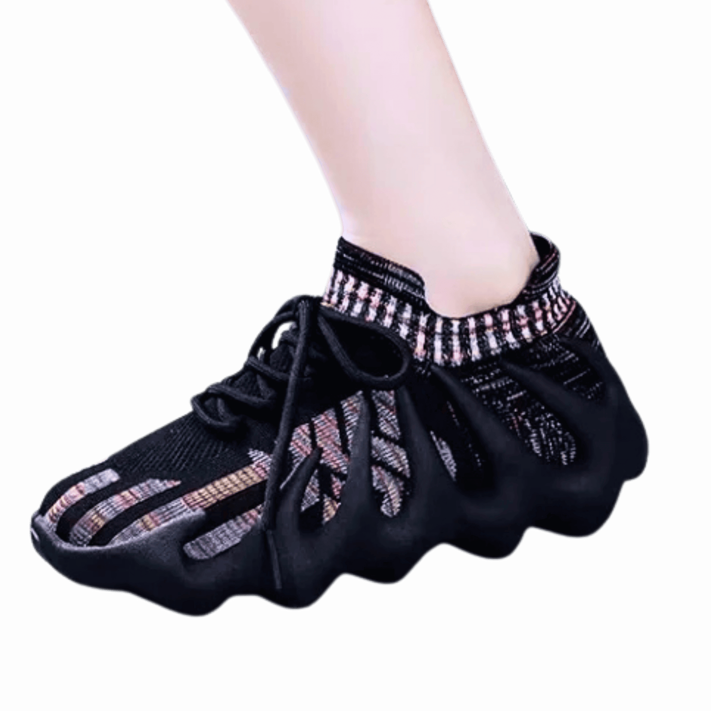 Black dance shoes with decorative elements on a black background