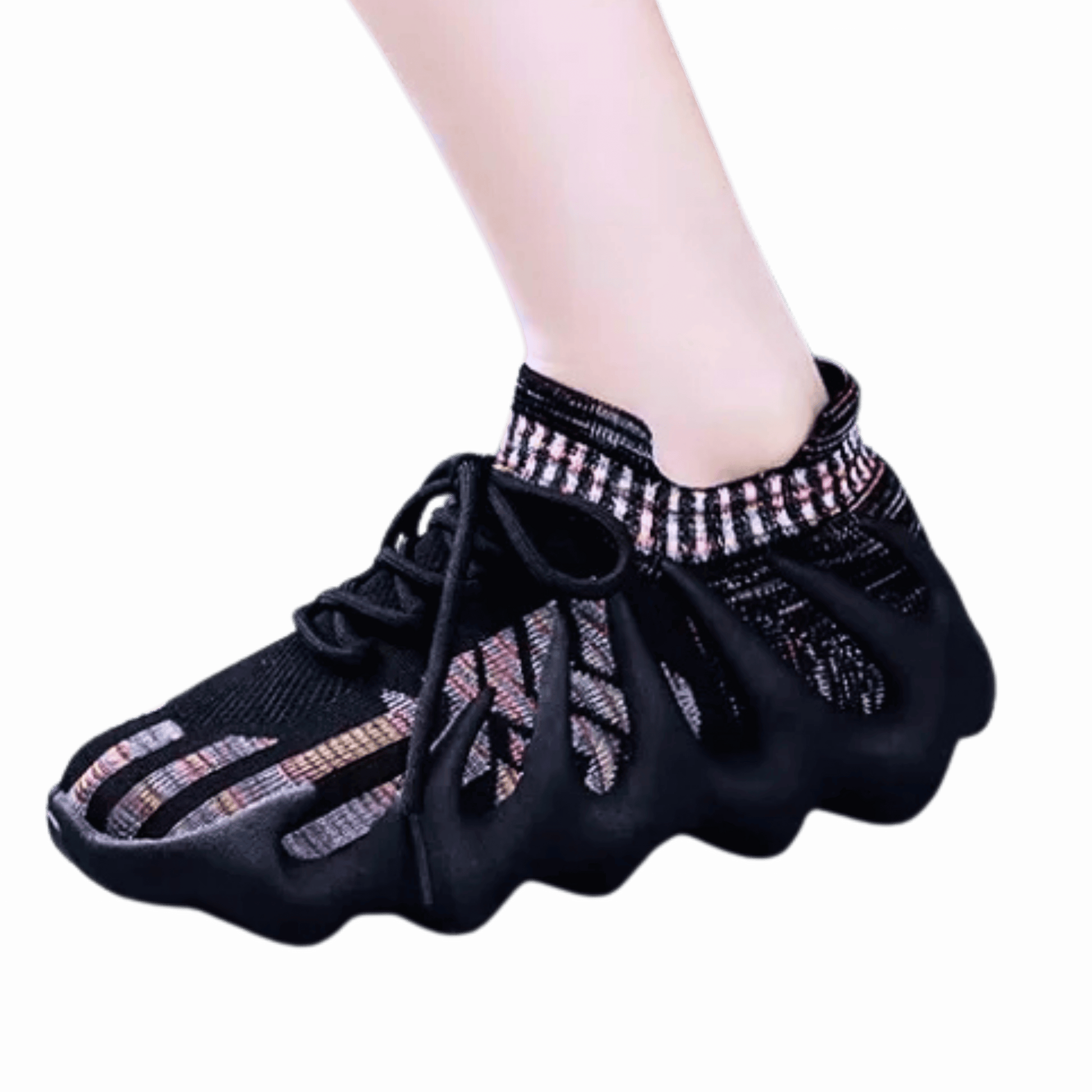 Black dance shoes with decorative elements on a black background