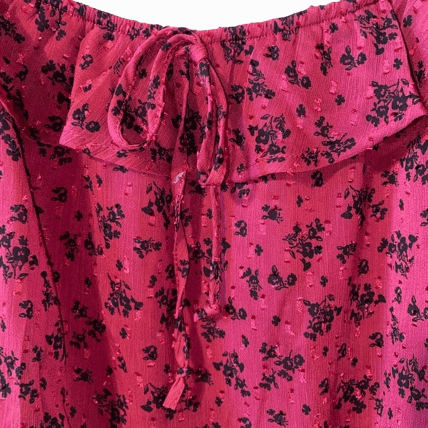 Pink fabric with black floral pattern